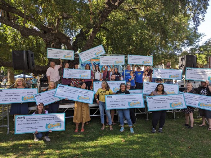 Photo of 2023 recipients of Chalk It Up grants holding oversized grant checks.